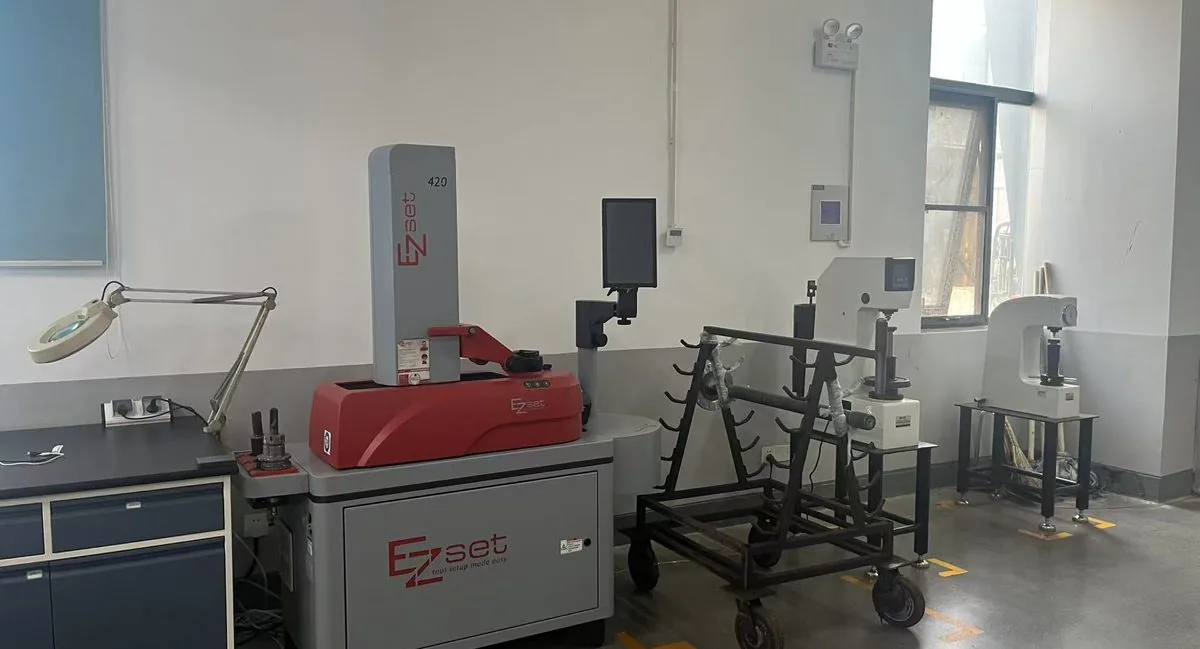 Quality lab with hardness tester, tool presetter, and part-handling station