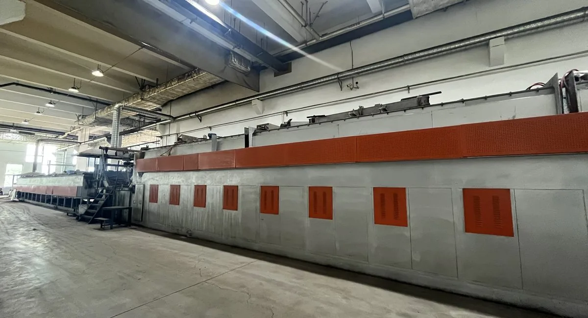 Continuous quench-and-temper heat-treatment furnace line